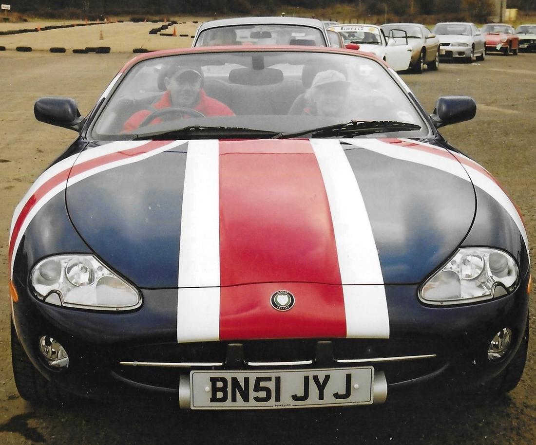 A Jaguar XK8 convertible with a Union Jack bonnet