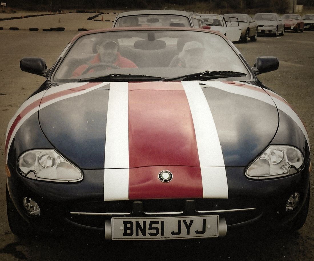 A Jaguar XK8 in the paddock